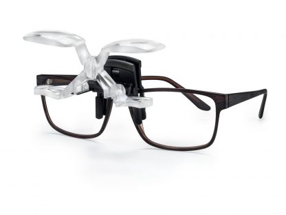 Image of black frame glasses with Max DETAIL attached to glasses with lens facing upwards