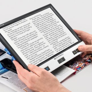 Image of hands holding a visolux digital over a magazine